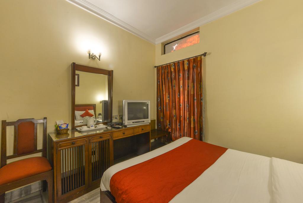 Camac Plaza Hotell Kolkata Rom bilde
